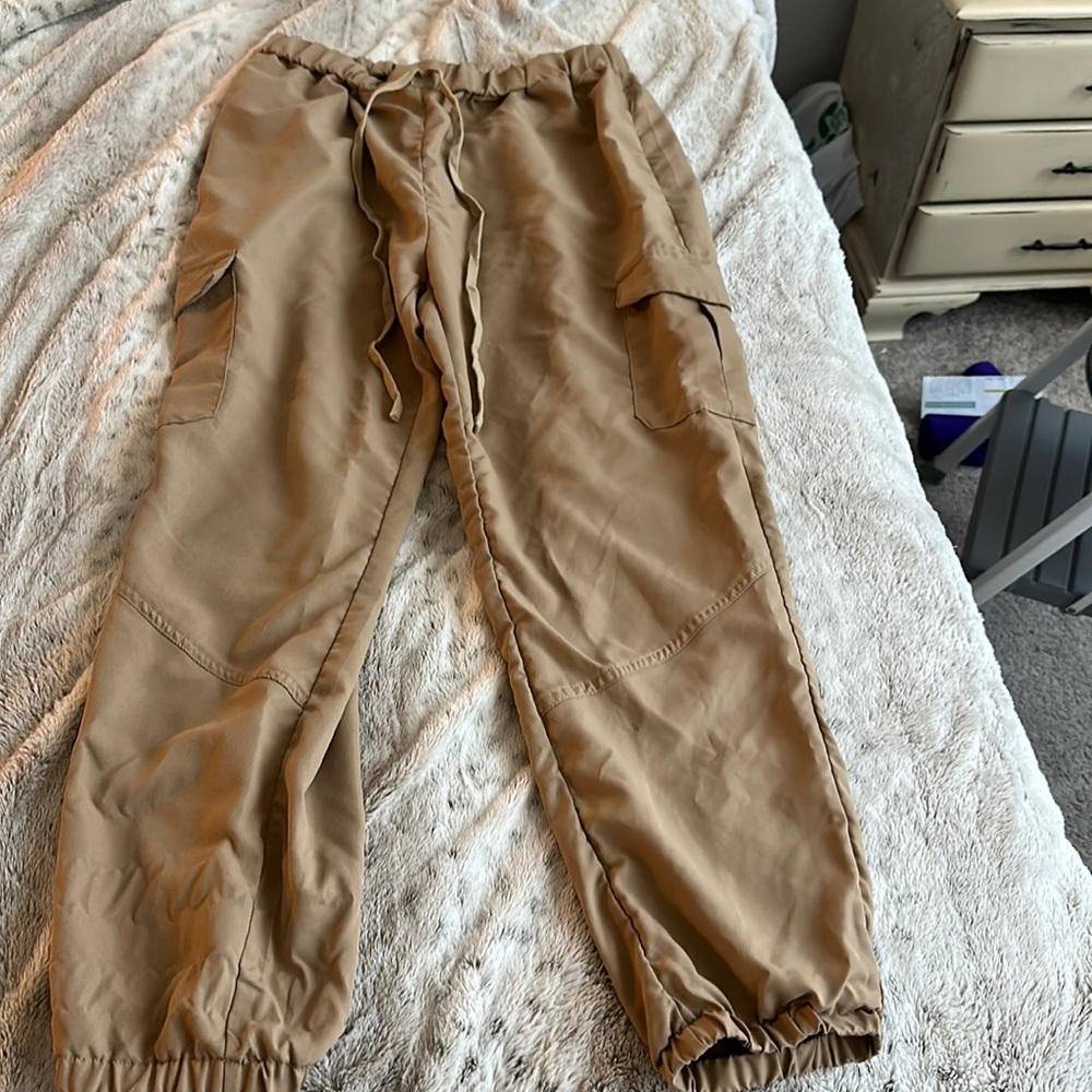 Tan silky feeling cargo pants. Size L